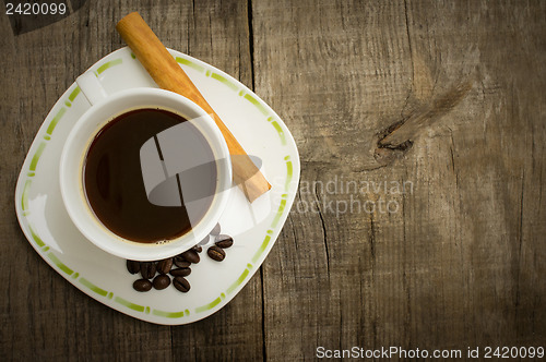 Image of Coffee Cup with beans and cinnamon stick