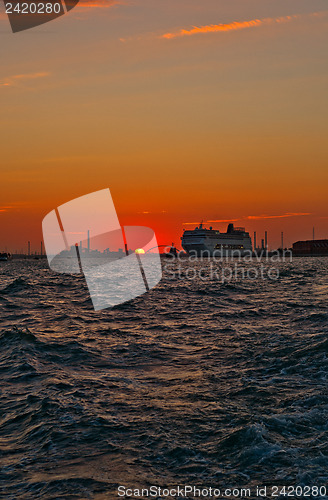 Image of Venice Italy sunset with cruise boat