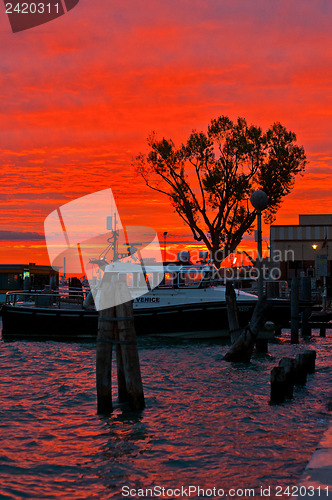 Image of Venice Italy sunset with cruise boat