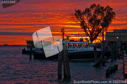 Image of Venice Italy sunset with cruise boat
