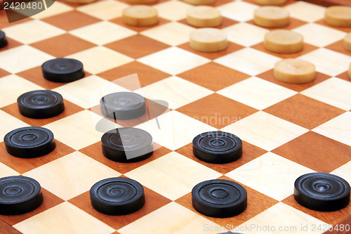 Image of checkerboard with checkers spaced