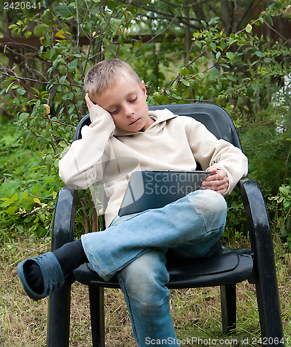 Image of Kid with tablet pc.