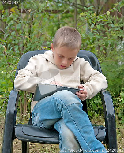 Image of Kid with tablet pc.