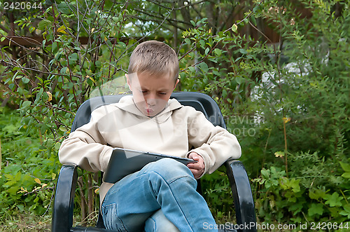 Image of Kid with tablet pc.