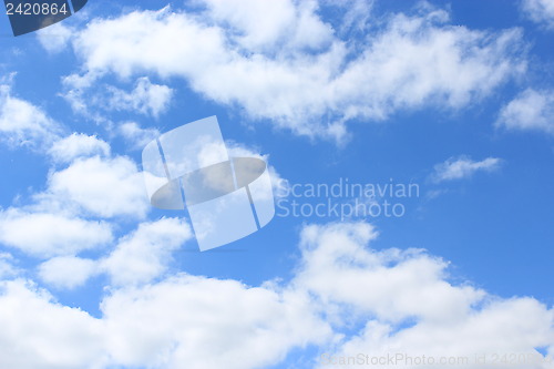 Image of picturesque white clouds on blue sky background