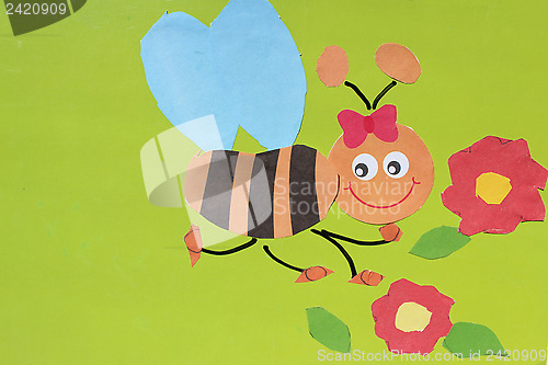 Image of toy bee made by children's hands from paper