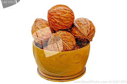 Image of Walnuts from juniper wood in a vase