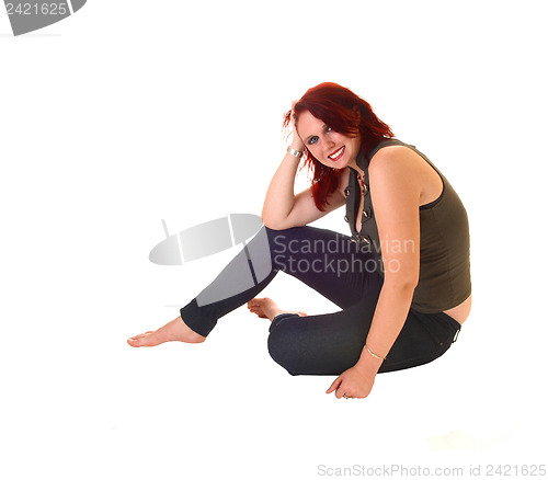 Image of Girl sitting on floor.