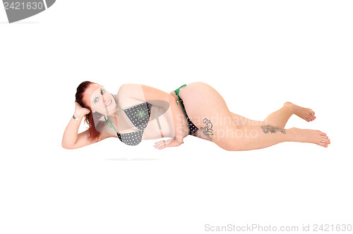 Image of Girl lying on floor.