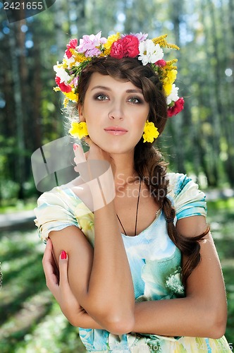 Image of Attractive woman with flower wreath