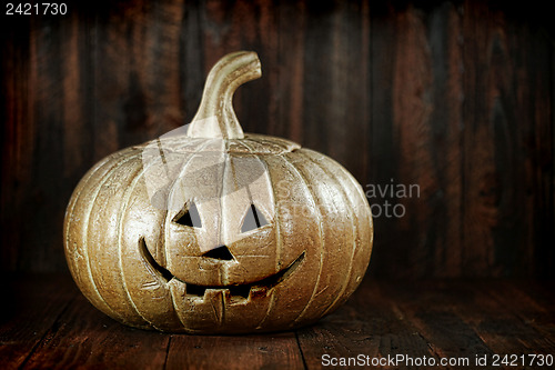 Image of Halloween Pumpkin on Wood Grunge Rustic Background