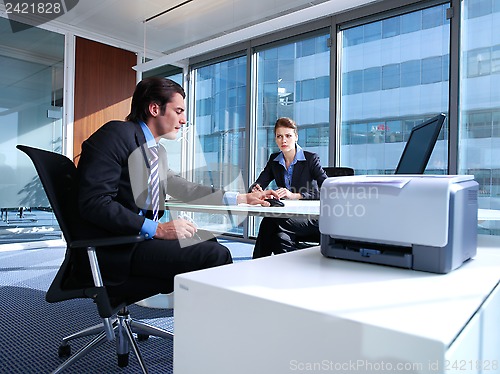 Image of business couple working at office