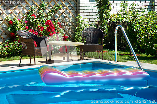 Image of pool with inflatable mattress