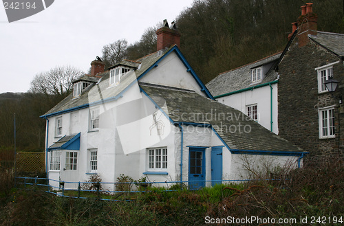 Image of old white washed cottage