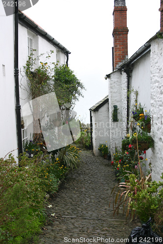 Image of old cottages with cobble path
