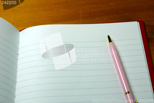 Image of pen on a notebook