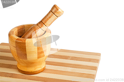 Image of Mortar and pestle on a cutting board