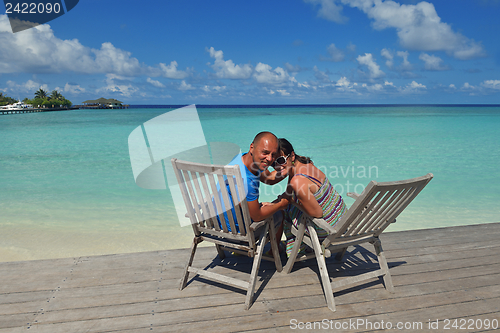 Image of happy young couple have fun on beach