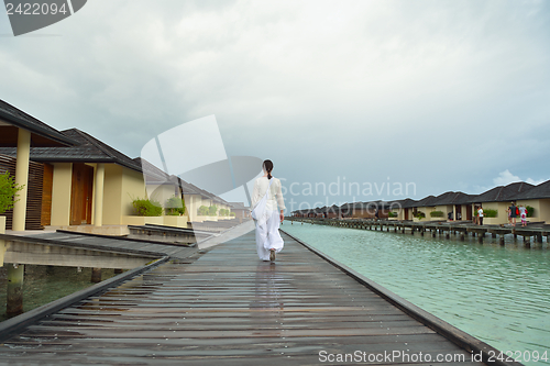 Image of young woman relax on cloudy summer day