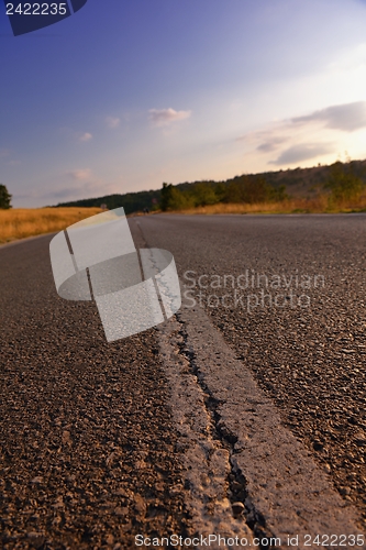 Image of road through the green field