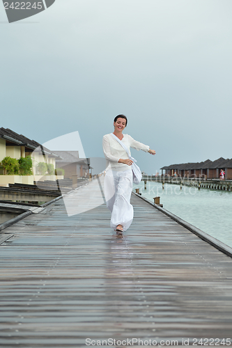 Image of young woman relax on cloudy summer day