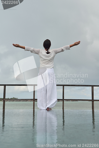 Image of young woman relax on cloudy summer day