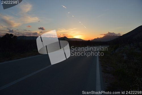 Image of road through the green field