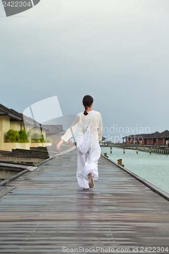 Image of young woman relax on cloudy summer day