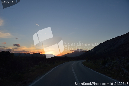 Image of road through the green field