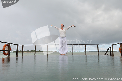 Image of young woman relax on cloudy summer day