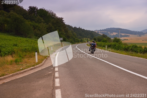 Image of road through the green field