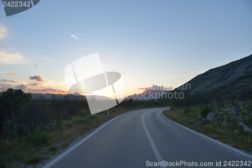 Image of road through the green field