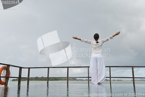 Image of young woman relax on cloudy summer day