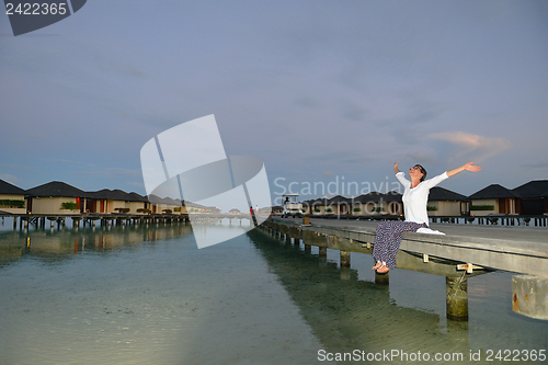 Image of young woman relax on cloudy summer day