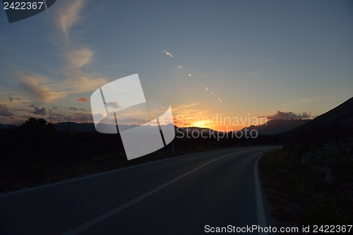 Image of road through the green field