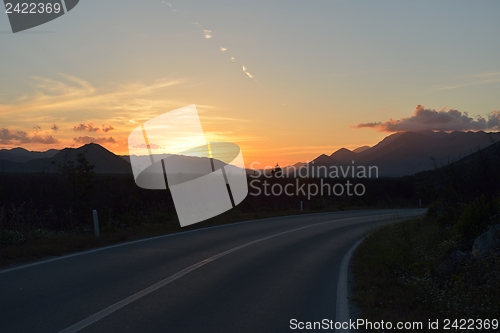 Image of road through the green field