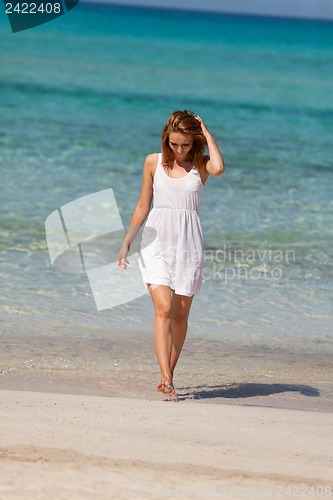 Image of beautiful happy woman on the beach lifestyle summertime