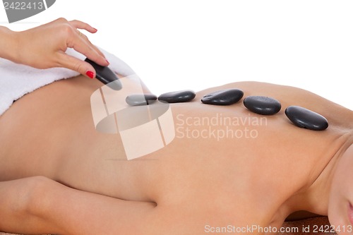 Image of attractive healthy caucasian woman hot stone massage wellness 