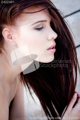 Image of beautiful woman portrait wirth long straight dark brown hair 