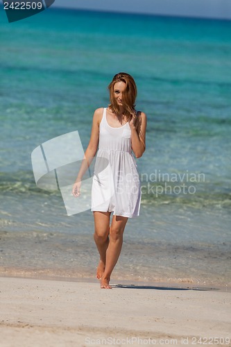 Image of beautiful happy woman on the beach lifestyle summertime
