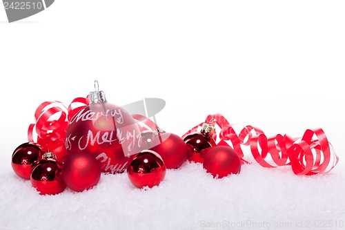 Image of christmas decoration festive red bauble in snow isolated