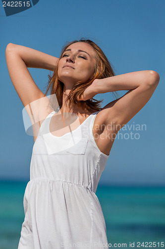 Image of beautiful happy woman on the beach lifestyle summertime