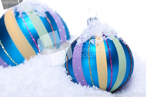 Image of christmas decoration baubles in blue and turquoise isolated