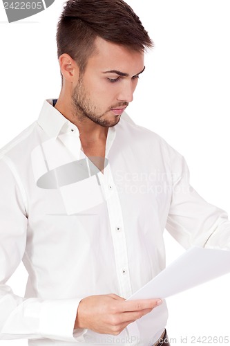 Image of young adult businessman reading document letter isolated