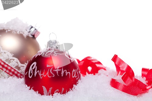 Image of christmas decoration festive red bauble in snow isolated