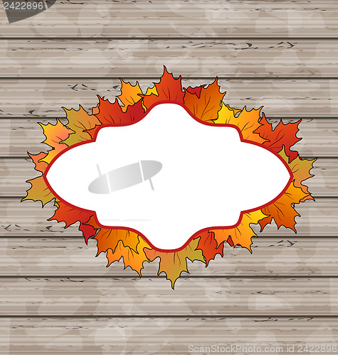 Image of Autumn emblem with leaves maple, wooden texture