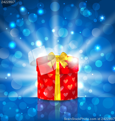 Image of Round gift box on light background with glow