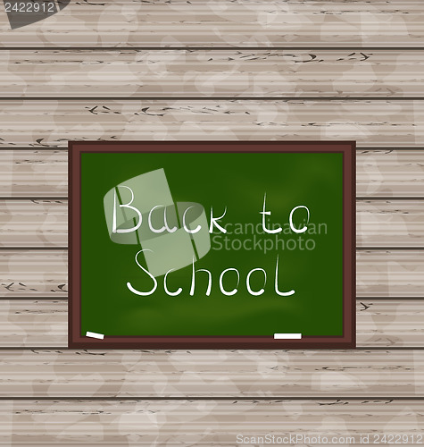 Image of School green board on wooden texture