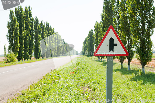 Image of sign in road. focus on sign