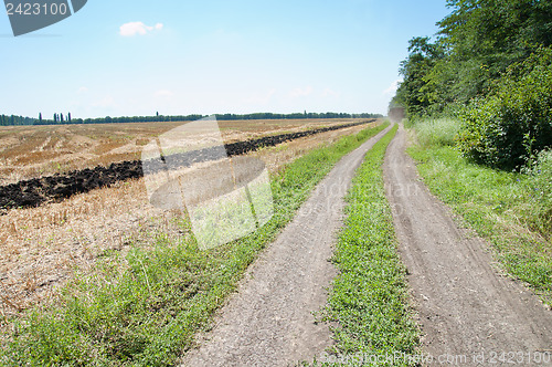 Image of rural road near field